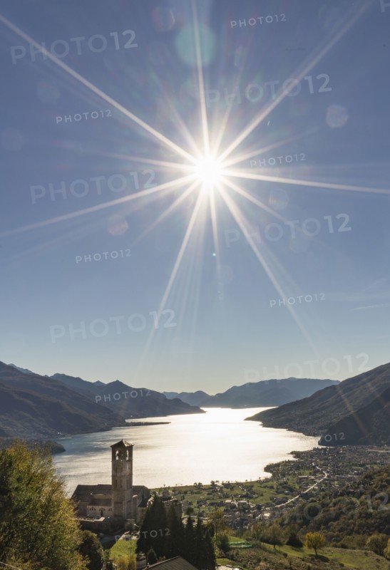 Sun in blue sky over Gravedona