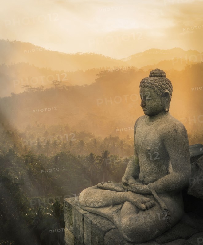 Statue of Buddha at sunset