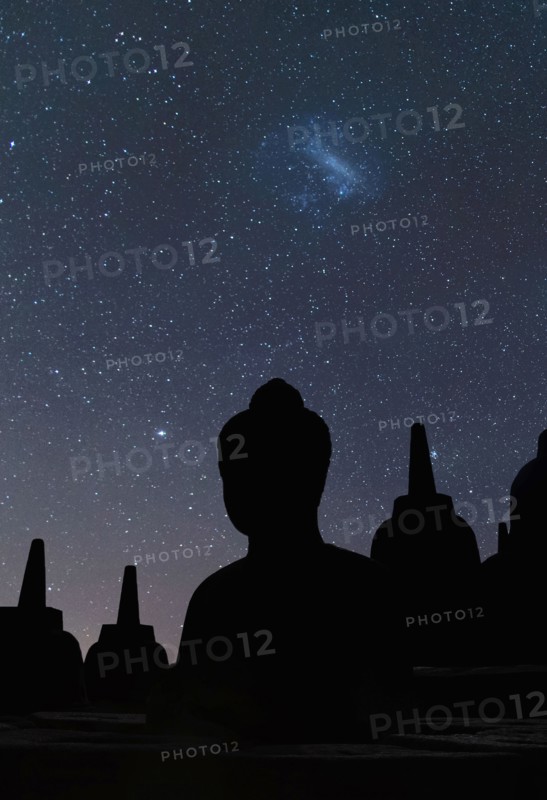 Silhouette of statue of Buddha at night