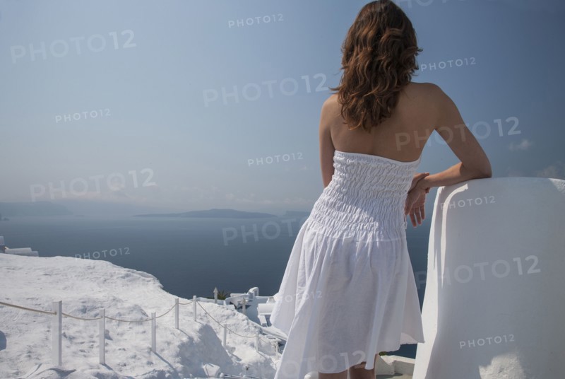 Caucasian woman admiring scenic view of ocean