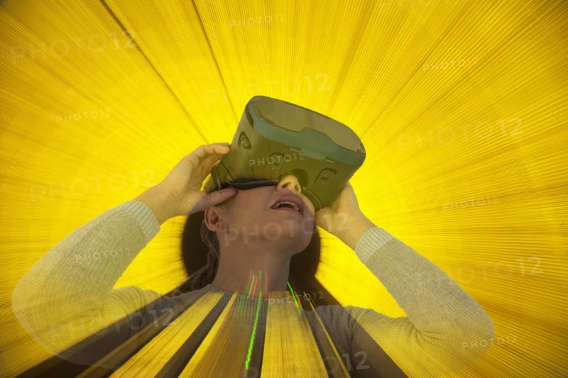 Caucasian woman wearing virtual reality goggles