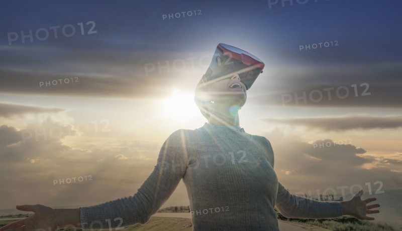 Caucasian woman wearing virtual reality goggles