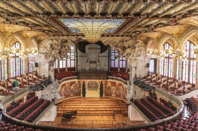 Piano near stage in ornate theater