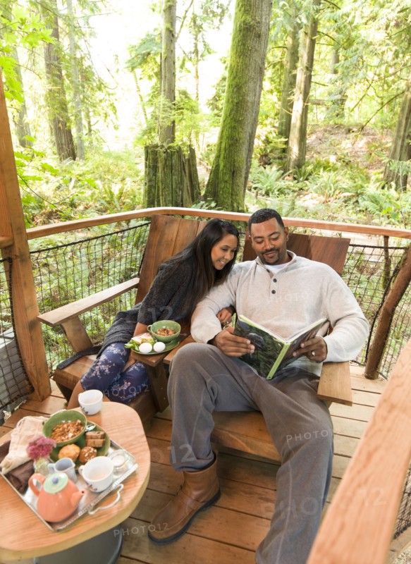 Couple relaxing together on deck