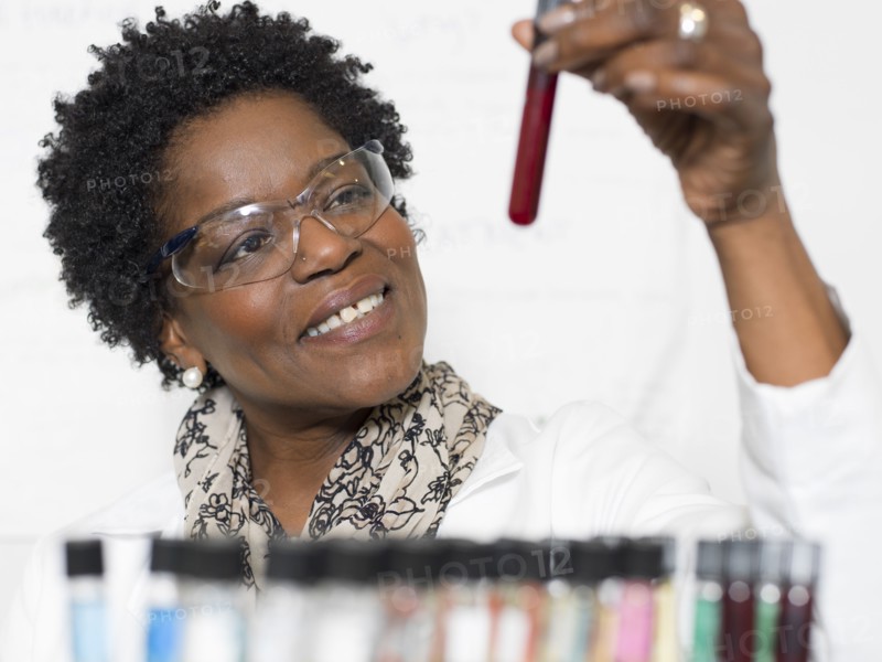 Black scientist examining samples in lab