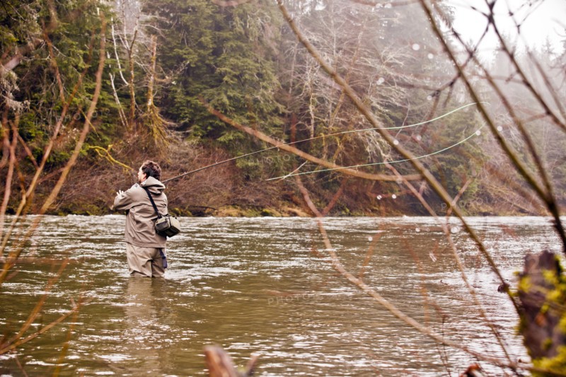 Man fly fishing in rural river