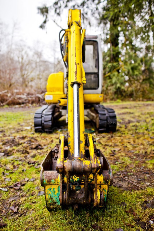 Close up of digger on mossy concrete