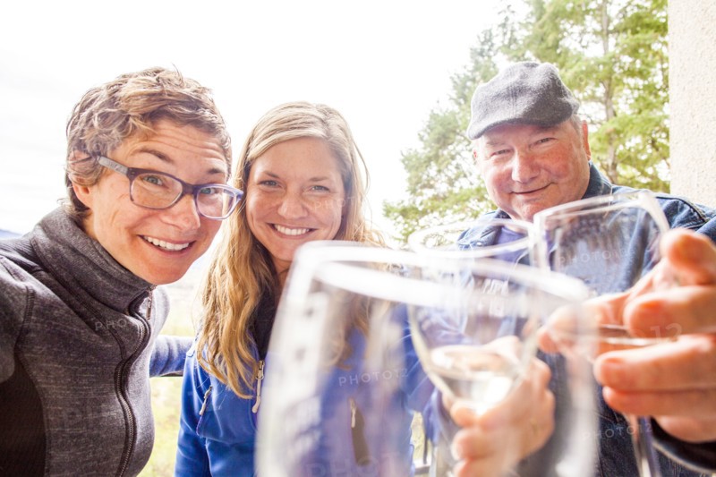 Caucasian family drinking wine together
