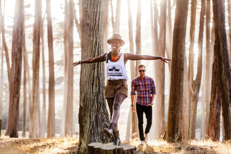 Couple exploring sunny forest