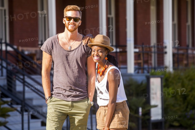 Laughing couple walking outdoors
