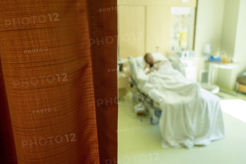 Defocused view of Caucasian woman laying in hospital bed