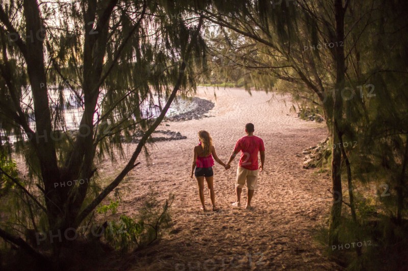 Couple holding hands on beach