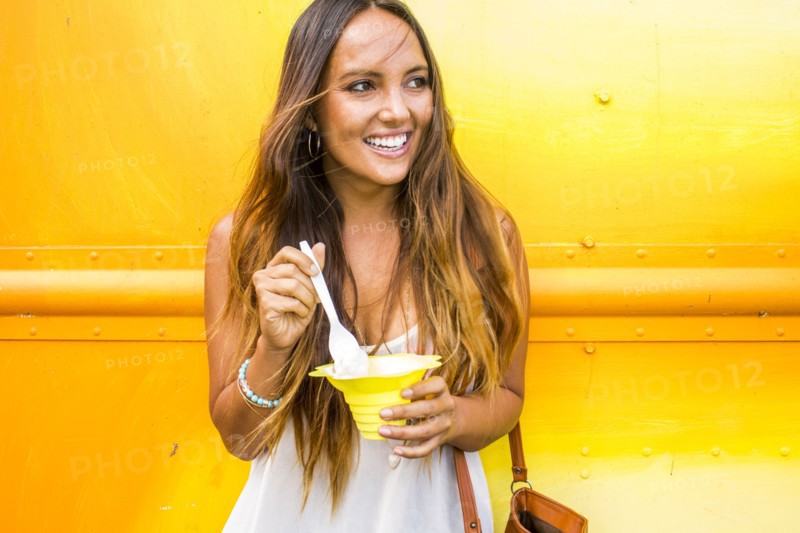 Caucasian woman eating shaved ice