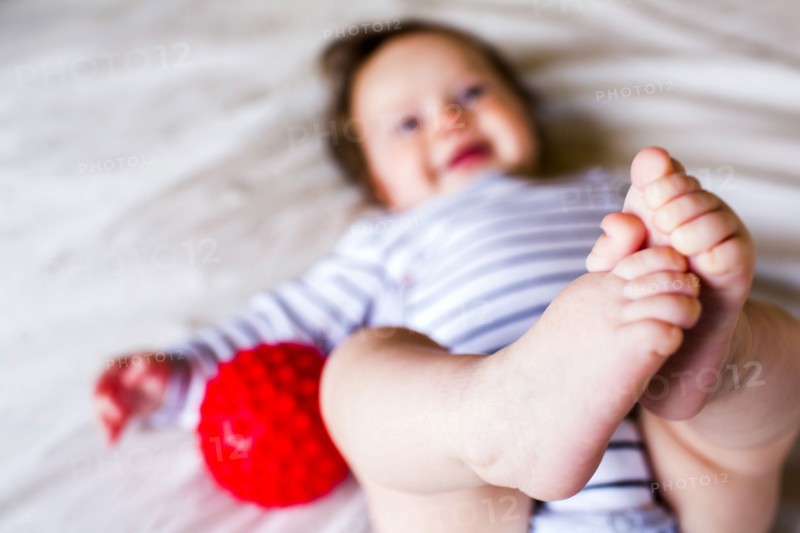 Close up of feet of Caucasian baby girl