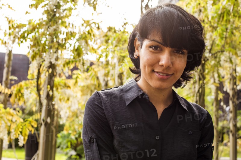Hispanic woman smiling in park