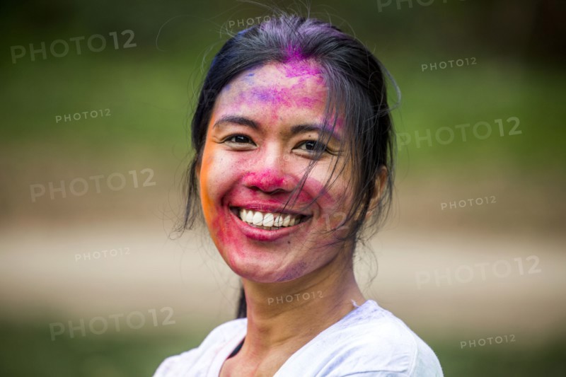 Asian woman with pigment powder on face