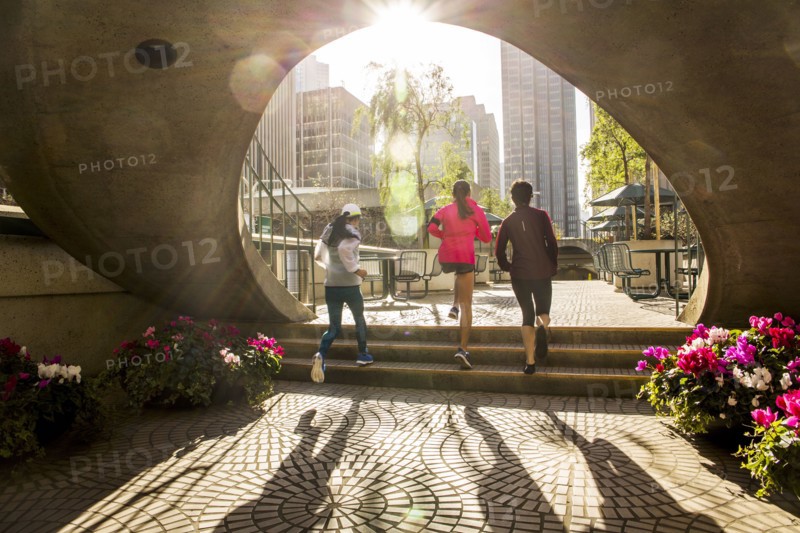 Women running in urban park