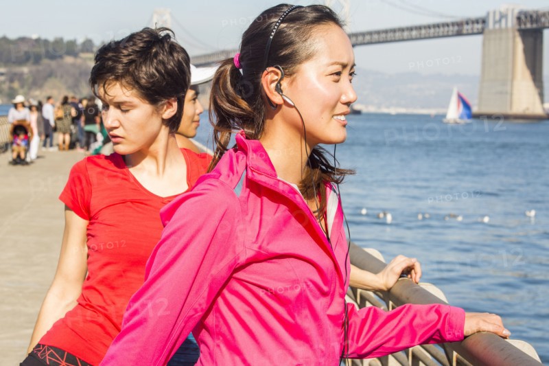 Runner stretching at waterfront