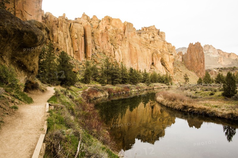 Desert cliffs reflecting in still river