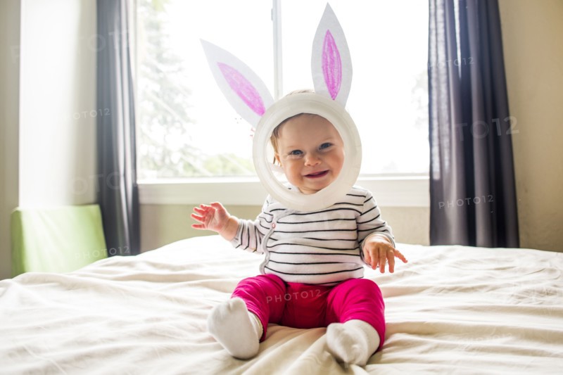 Caucasian baby girl wearing Easter Bunny costume