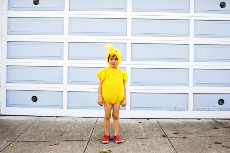 Mixed race boy wearing costume