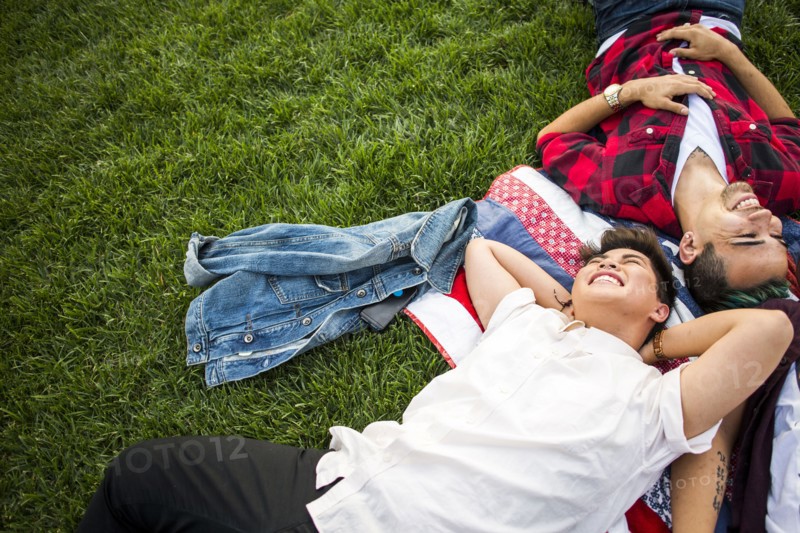 Friends laying in grass