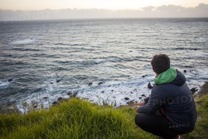 Caucasian man admiring ocean horizon