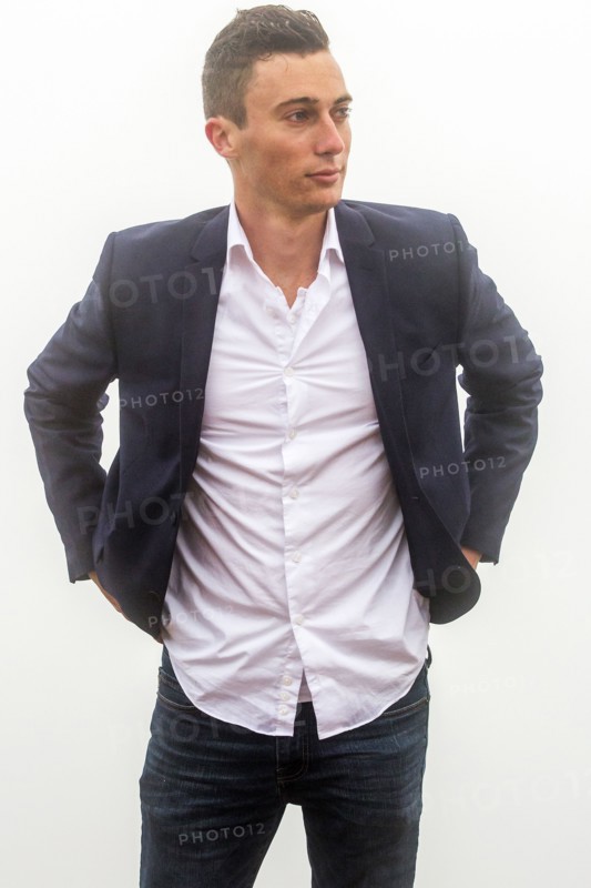 Caucasian man standing in fog