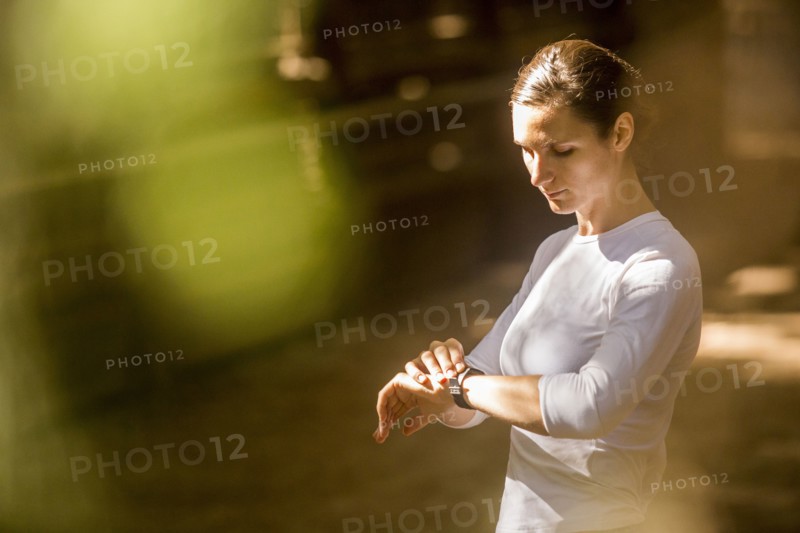 Woman checking wristwatch