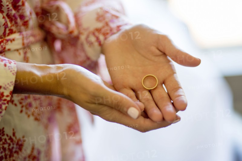 Caucasian woman holding wedding ring