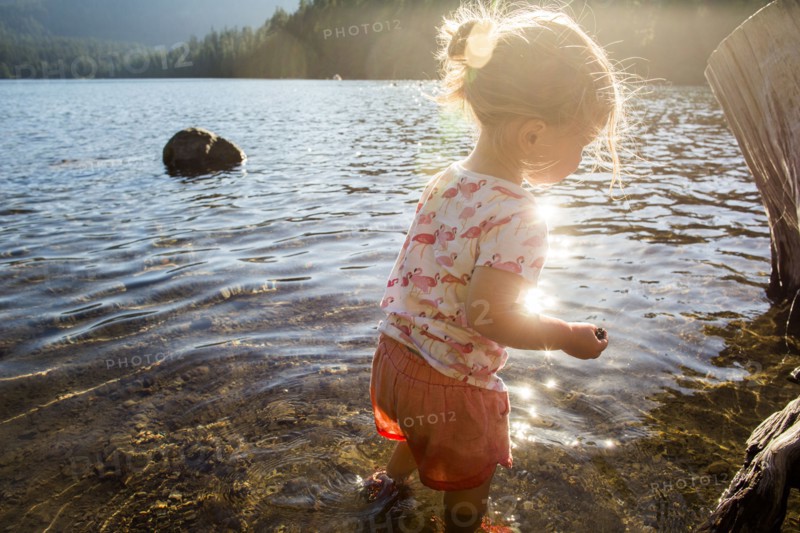 Caucasian wading in river