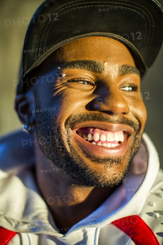 Smiling Black man looking away