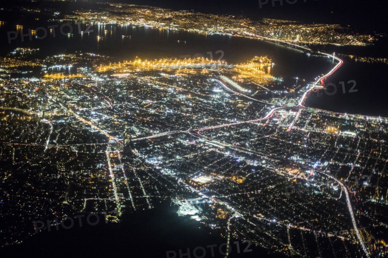 Aerial view of illuminated city at night