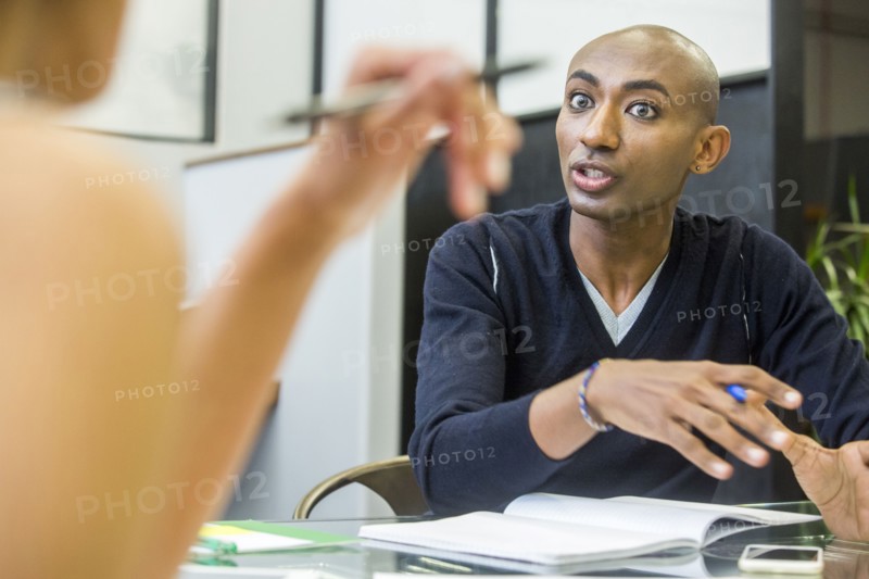 Serious people talking in meeting