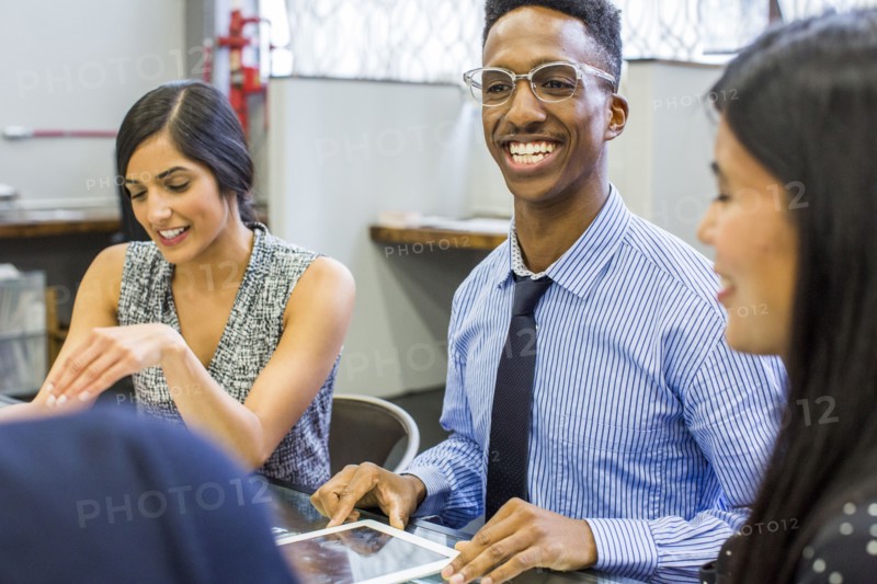 Smiling people talking in meeting