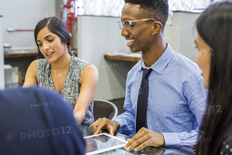 Smiling people talking in meeting