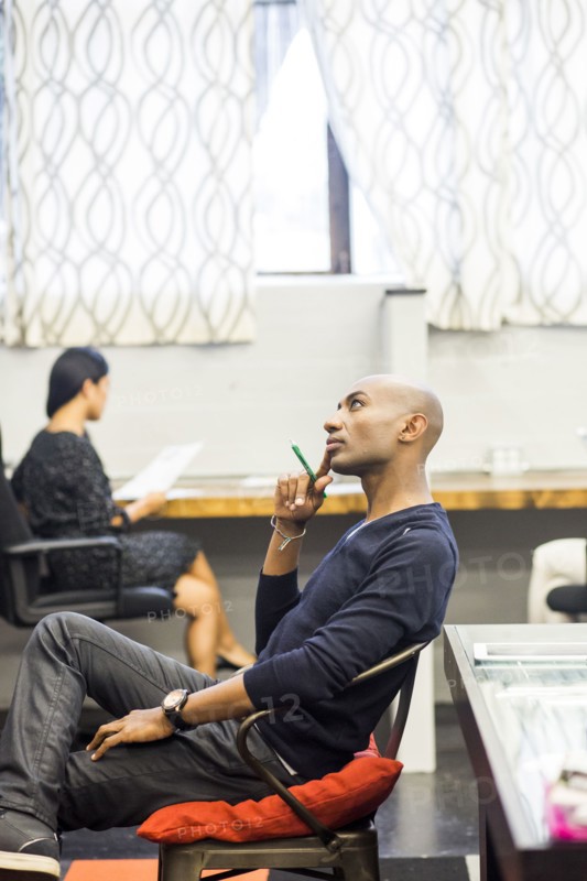 Portrait of pensive African American man sitting in office