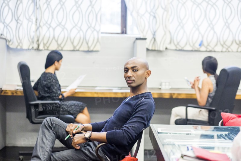 Portrait of serious African American man sitting in office
