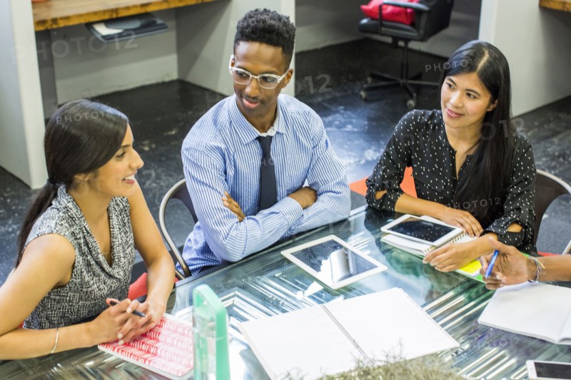 Smiling people talking in meeting
