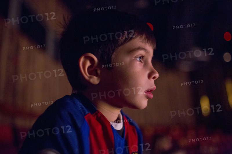 Mixed Race girl boy watching movie in theater