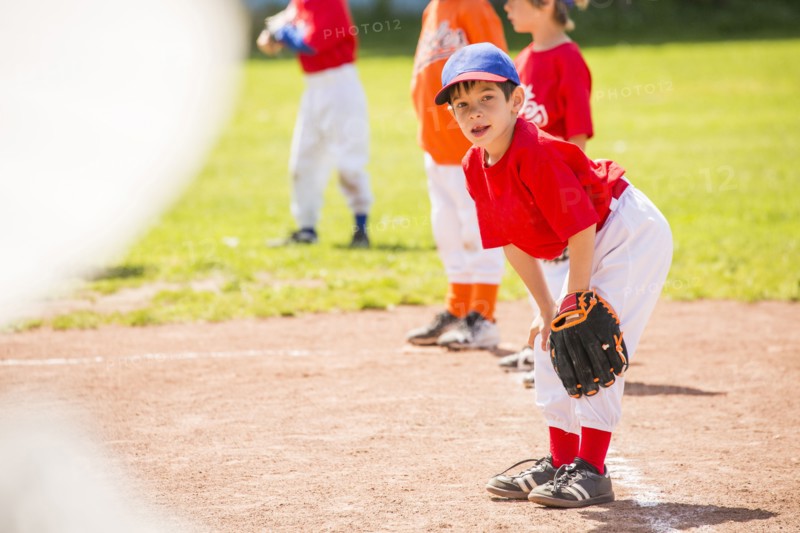 Mixed Race boy playing baseball
