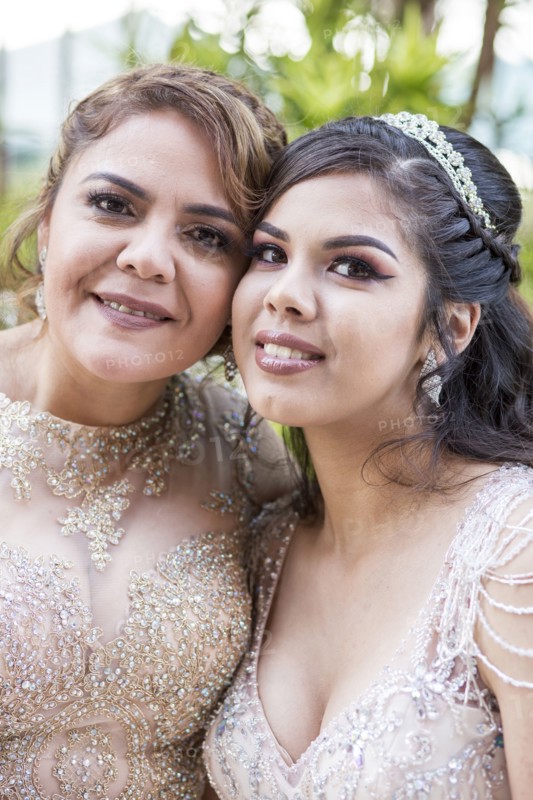 Portrait of smiling Hispanic mother and daughter