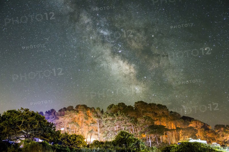 Starry night sky above mountains
