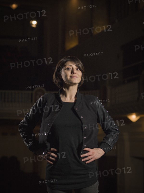 Caucasian woman standing in movie theater