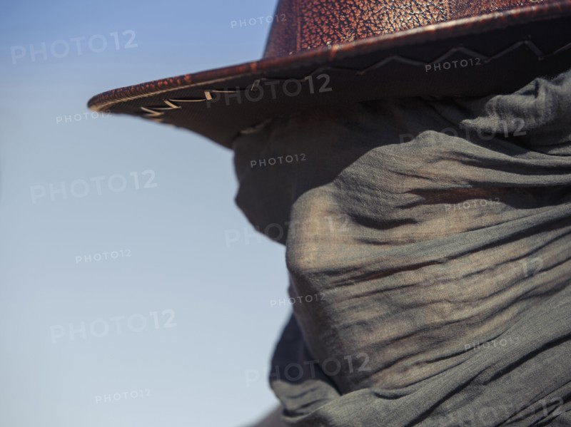 Close up of Caucasian traveler wearing face scarf