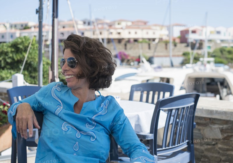 Caucasian woman sitting at outdoor cafe