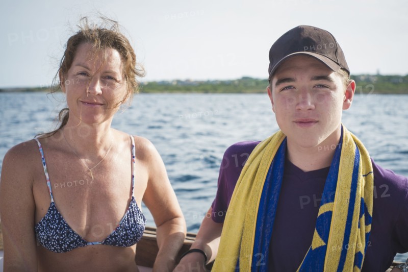 Caucasian mother and son on boat