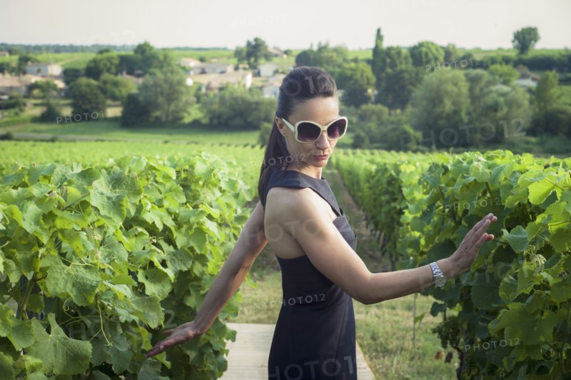 Playful Caucasian woman in vineyard