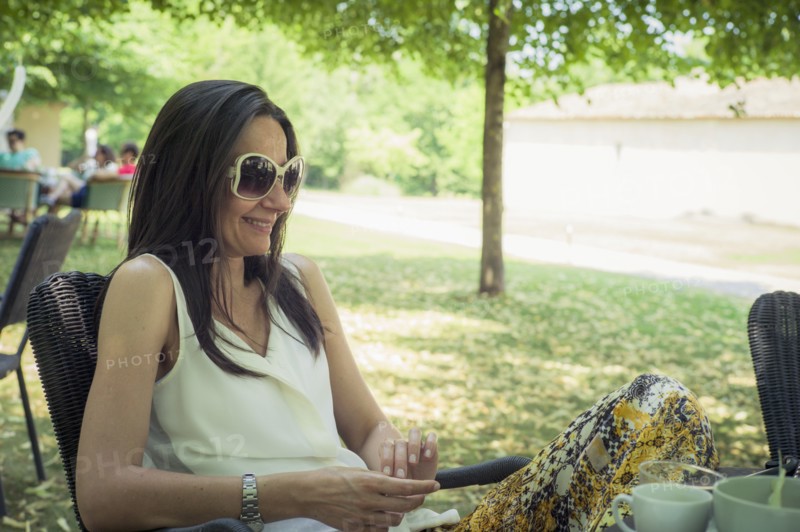 Caucasian woman sitting in chair in backyard