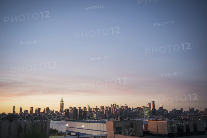 New York city skyline under sunset